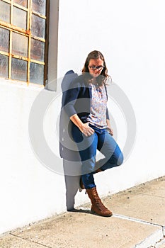 Girl Leaning Against Wall