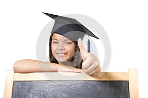 Girl leaning on blackboard