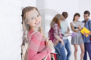 Girl leaning on a wall