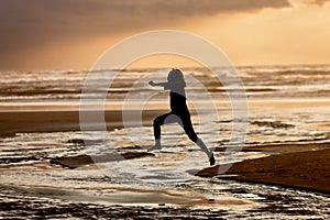 Girl leaps into the water.