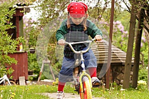 Girl learning drive bicycle