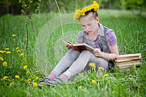 Girl learning in meadow