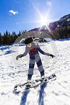 Girl learning snowboard