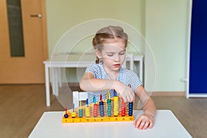 Girl learning to add and subtract accounts.