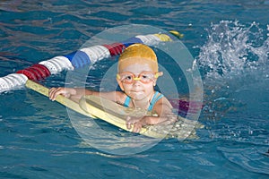 Girl learning to swim