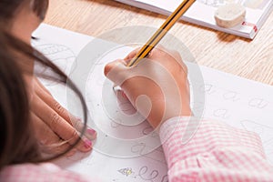 Girl learning to write