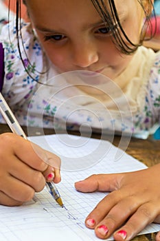 Girl learning to write