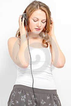 Girl leisurely listens to audio