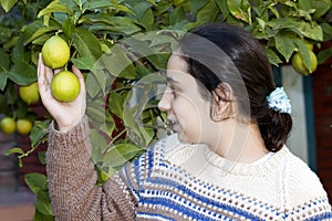 Girl with lemon tree