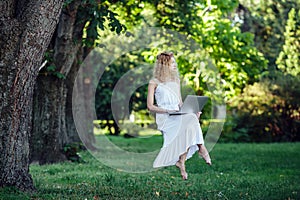 Girl levitates with laptop