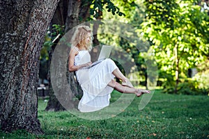 Girl levitates with laptop