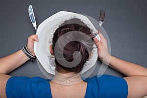 Girl is licking the plate