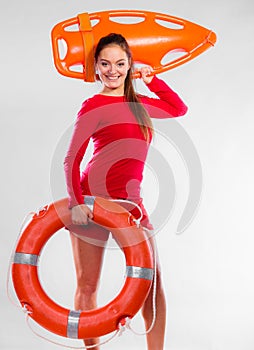 Girl lifeguard with rescue equipment