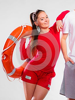 Girl lifeguard with rescue equipment