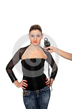 Girl and a lightmeter on a studio