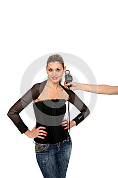 Girl and a lightmeter on a studio