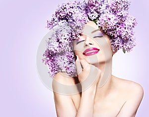 Girl with lilac flowers hairstyle