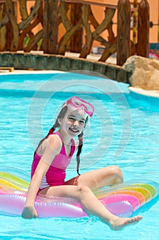 Girl on lilo in pool