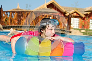 Girl on lilo in pool