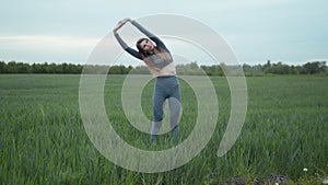 Girl Limbering-Up And Stretching Arms After Running Jog Workout. Woman Stretching And Warming-Up Before Running.Athlete