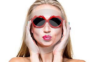 Girl in lips shaped sunglasses