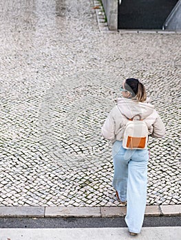 Girl in Lisbon Urban Elegance - White Pavement Crossing