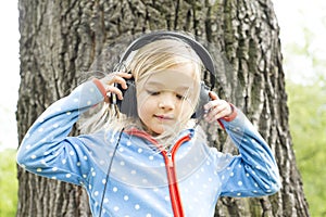 Girl listen to music on headphones