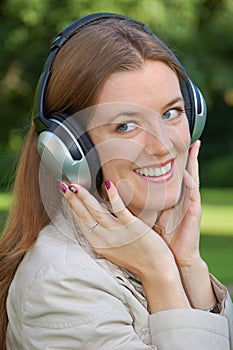 Girl is listening music with headphones