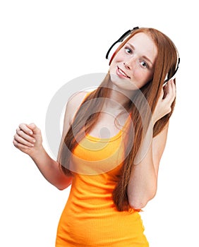 Girl listening music on headphones. Isolated on white backgroun