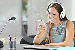 Girl listening music with smartphone and headphones