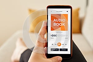 Girl listening to an audiobook photo