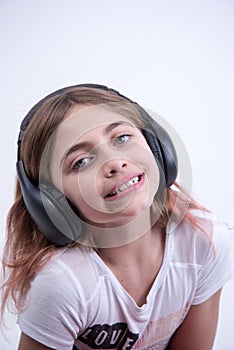 Girl listening to lovely music on headphone
