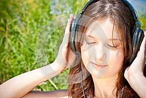 Girl listening to music in headphones