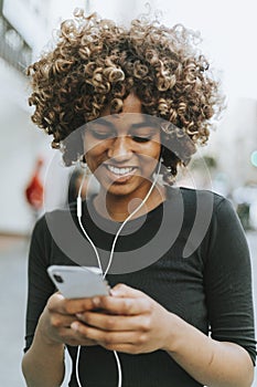 Girl listening to music from her phone