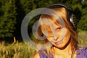 Girl listening to music in the open