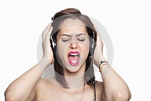 Girl listening to music and singing