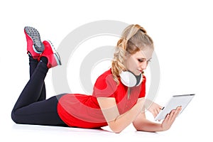 Girl listening to music on a tablet computer.