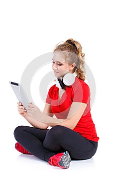 Girl listening to music on a tablet computer.