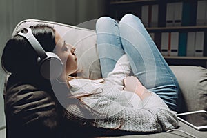 Girl listening to relaxing music photo