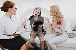 Girl Listens to Music in Psychologist Office