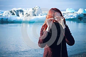 Girl with little iceberg in Iceberg Field, Iceland