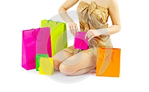 A girl loking in paper bags