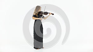 Girl in a long black dress playing the violin