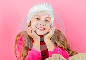 Girl long hair dream pink background. Kid dreamy wear knitted hat. Winter season coziness attribute. Winter season