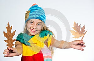 Girl long hair happy face wear bright knitted hat and scarf white background. How to style colourful accessory for