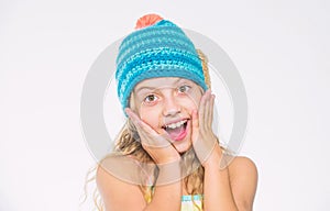 Girl long hair happy face white background. Kid wear warm soft knitted blue hat. Difference between knitting and crochet