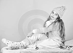 Girl long hair relaxing pink background. Winter fashion for children. Kid smiling fashion model. Winter fashion concept