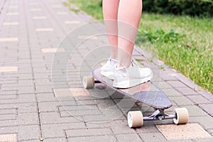 girl on a longboard riding around the city