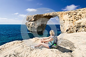 Girl looking on Azure Window on Gozo Island