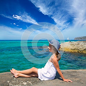 Girl looking at beach in Formentera turquoise Mediterranean